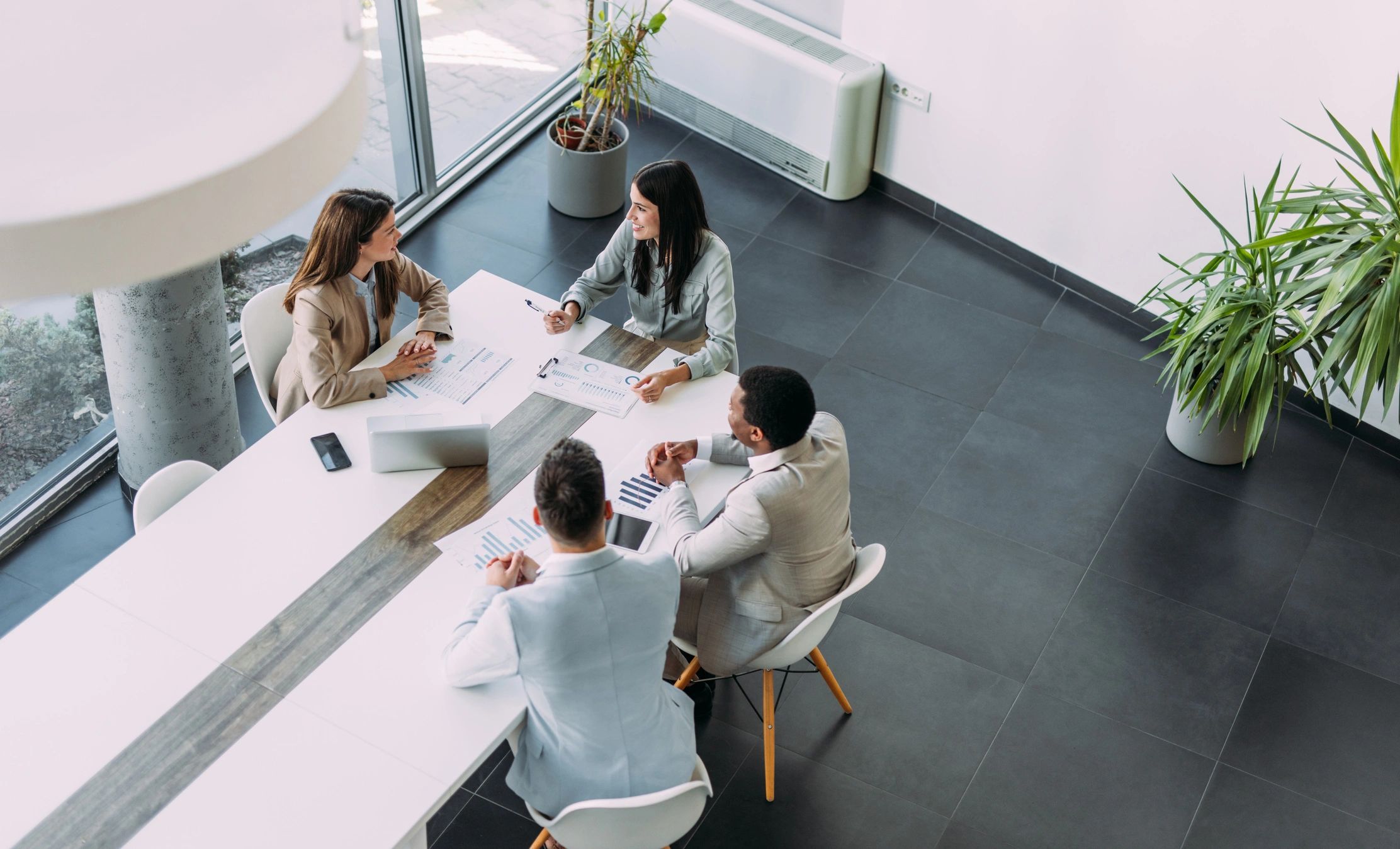 Financial advisors collaborating in an office meeting