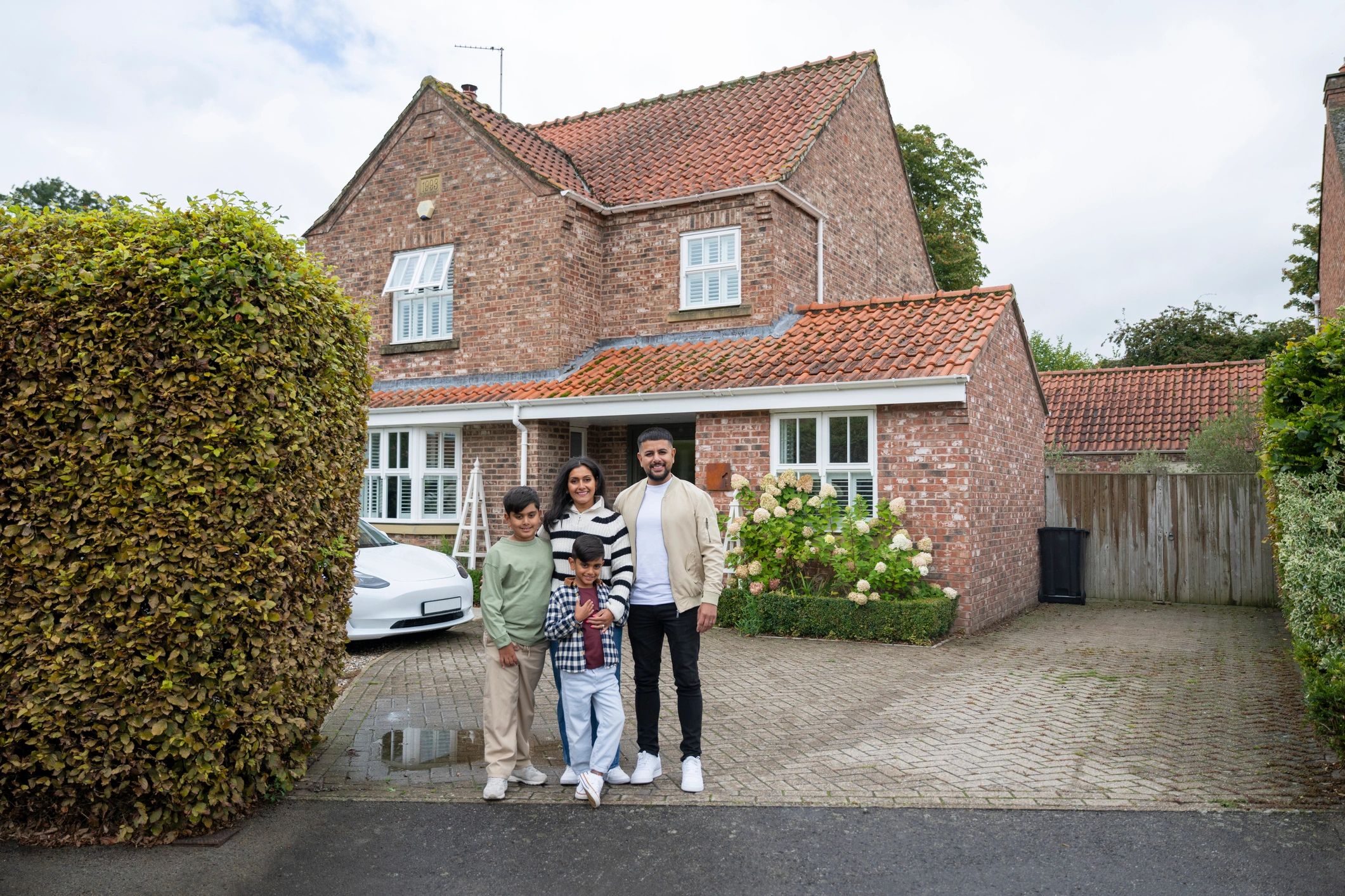 Family in front of their home